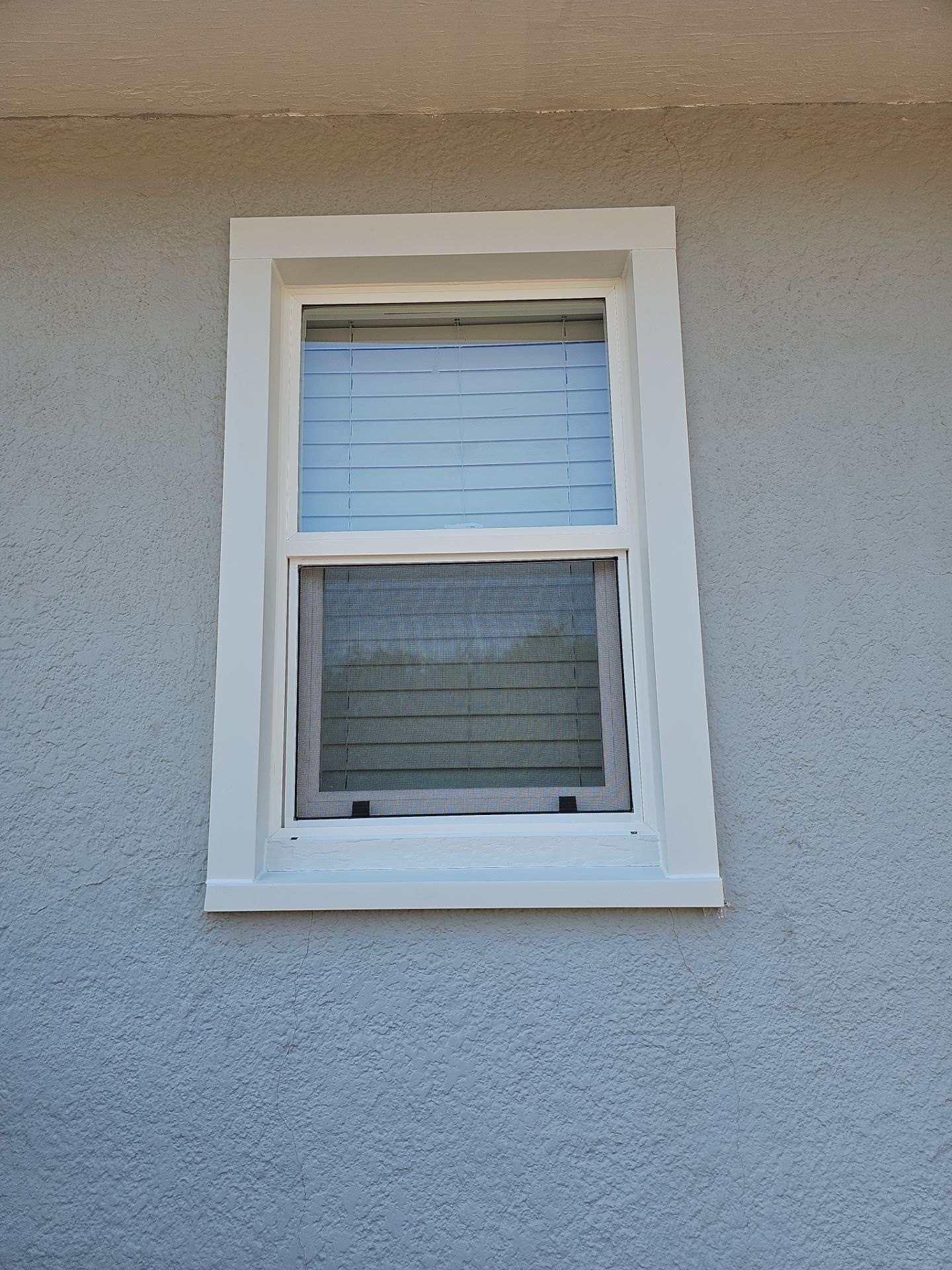 After: finished replacement window and exterior trim detail