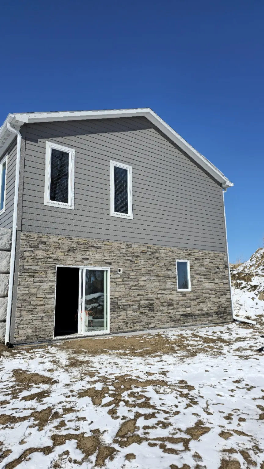 Tundra Gray siding with stone veneer exterior on a Black Hills area home