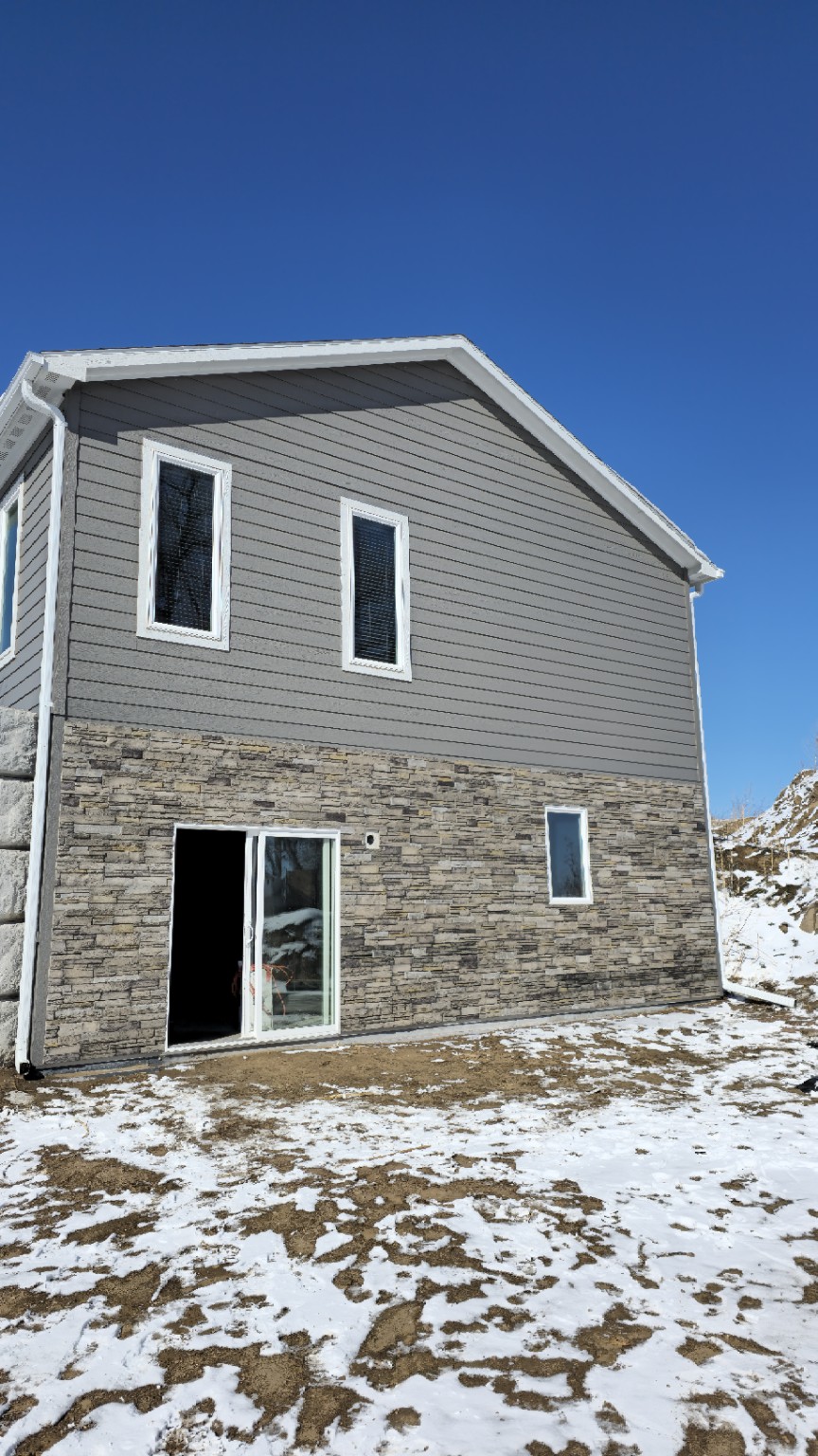 Completed Golden Ridge Exteriors siding and stone exterior project